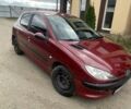 Красный Пежо 206, объемом двигателя 1.36 л и пробегом 181 тыс. км за 3900 $, фото 1 на Automoto.ua