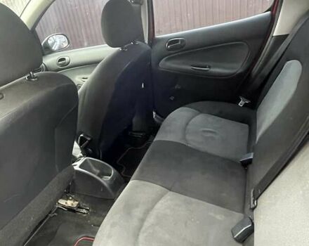 Красный Пежо 206, объемом двигателя 1.36 л и пробегом 181 тыс. км за 3900 $, фото 8 на Automoto.ua