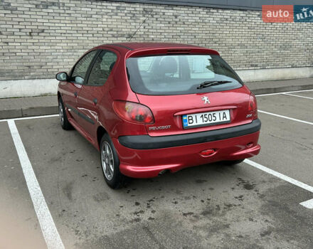 Красный Пежо 206, объемом двигателя 1.4 л и пробегом 76 тыс. км за 5200 $, фото 4 на Automoto.ua