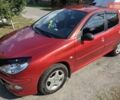 Красный Пежо 206, объемом двигателя 1.36 л и пробегом 146 тыс. км за 4000 $, фото 4 на Automoto.ua