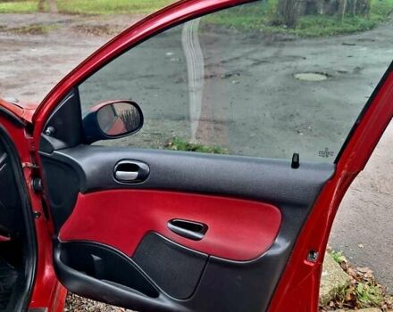 Красный Пежо 206, объемом двигателя 1.36 л и пробегом 226 тыс. км за 3799 $, фото 28 на Automoto.ua