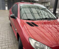 Красный Пежо 206, объемом двигателя 1.36 л и пробегом 133 тыс. км за 3800 $, фото 3 на Automoto.ua