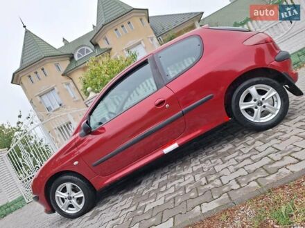 Красный Пежо 206, объемом двигателя 1.4 л и пробегом 229 тыс. км за 2100 $, фото 1 на Automoto.ua