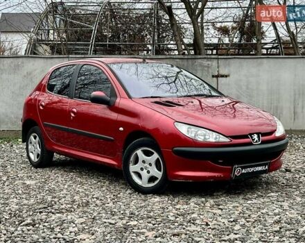 Красный Пежо 206, объемом двигателя 1.36 л и пробегом 232 тыс. км за 2990 $, фото 1 на Automoto.ua