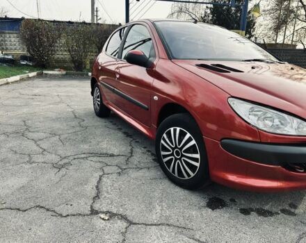 Красный Пежо 206, объемом двигателя 1.4 л и пробегом 241 тыс. км за 3200 $, фото 1 на Automoto.ua