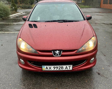 Красный Пежо 206, объемом двигателя 1.59 л и пробегом 269 тыс. км за 3900 $, фото 1 на Automoto.ua