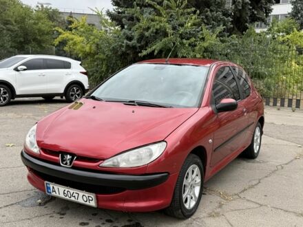Красный Пежо 206, объемом двигателя 1.4 л и пробегом 203 тыс. км за 3500 $, фото 1 на Automoto.ua