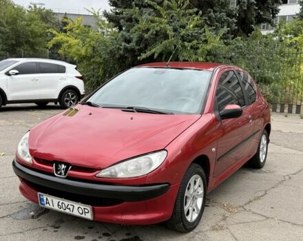 Красный Пежо 206, объемом двигателя 1.4 л и пробегом 203 тыс. км за 3500 $, фото 1 на Automoto.ua