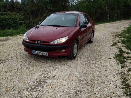 Красный Пежо 206, объемом двигателя 1.4 л и пробегом 260 тыс. км за 2950 $, фото 1 на Automoto.ua