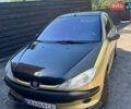 Желтый Пежо 206, объемом двигателя 1.2 л и пробегом 230 тыс. км за 2100 $, фото 1 на Automoto.ua