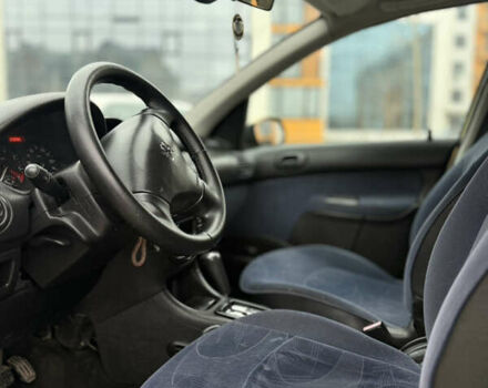 Желтый Пежо 206, объемом двигателя 1.36 л и пробегом 209 тыс. км за 3199 $, фото 8 на Automoto.ua