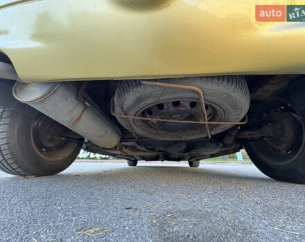 Желтый Пежо 206, объемом двигателя 1.12 л и пробегом 181 тыс. км за 2500 $, фото 11 на Automoto.ua