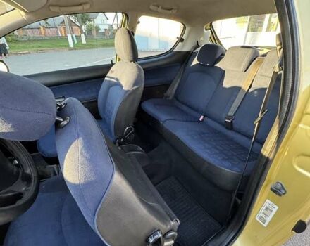 Желтый Пежо 206, объемом двигателя 1.12 л и пробегом 181 тыс. км за 2500 $, фото 15 на Automoto.ua