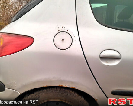 Серый Пежо 206, объемом двигателя 1.9 л и пробегом 308 тыс. км за 2500 $, фото 6 на Automoto.ua