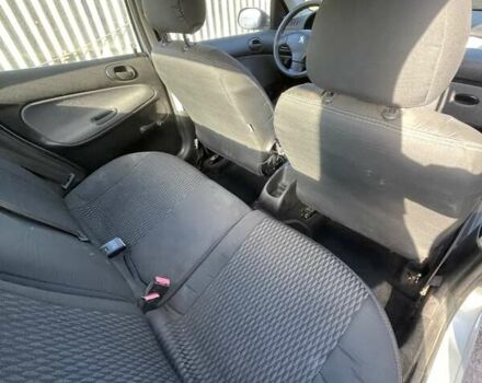 Серый Пежо 206, объемом двигателя 1.36 л и пробегом 150 тыс. км за 3500 $, фото 18 на Automoto.ua