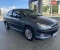 Серый Пежо 206, объемом двигателя 1.36 л и пробегом 245 тыс. км за 4499 $, фото 2 на Automoto.ua