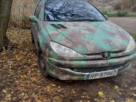 Зелений Пежо 206, об'ємом двигуна 1.4 л та пробігом 311 тис. км за 1118 $, фото 1 на Automoto.ua