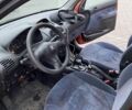 Помаранчевий Пежо 206, об'ємом двигуна 1.4 л та пробігом 143 тис. км за 2000 $, фото 5 на Automoto.ua