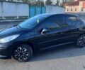 Черный Пежо 207, объемом двигателя 1.36 л и пробегом 145 тыс. км за 4900 $, фото 1 на Automoto.ua