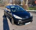 Черный Пежо 207, объемом двигателя 1.36 л и пробегом 145 тыс. км за 4900 $, фото 1 на Automoto.ua