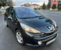 Черный Пежо 207, объемом двигателя 1.6 л и пробегом 205 тыс. км за 4250 $, фото 1 на Automoto.ua