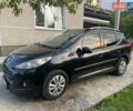 Черный Пежо 207, объемом двигателя 1.6 л и пробегом 225 тыс. км за 6000 $, фото 1 на Automoto.ua