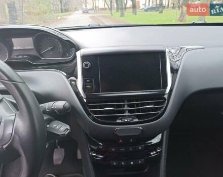 Белый Пежо 208, объемом двигателя 1.5 л и пробегом 84 тыс. км за 9400 $, фото 11 на Automoto.ua