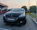 Чорний Пежо 208, об'ємом двигуна 1.4 л та пробігом 142 тис. км за 6350 $, фото 1 на Automoto.ua