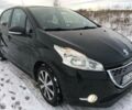 Чорний Пежо 208, об'ємом двигуна 1.4 л та пробігом 195 тис. км за 7650 $, фото 1 на Automoto.ua