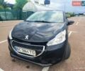 Черный Пежо 208, объемом двигателя 1.2 л и пробегом 137 тыс. км за 6500 $, фото 1 на Automoto.ua