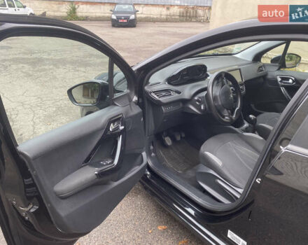 Черный Пежо 208, объемом двигателя 1.56 л и пробегом 214 тыс. км за 8250 $, фото 8 на Automoto.ua