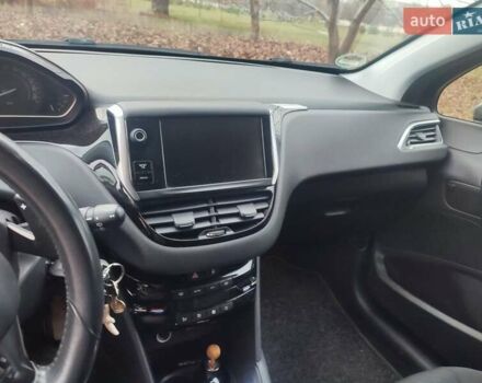 Серый Пежо 208, объемом двигателя 1.57 л и пробегом 190 тыс. км за 7700 $, фото 11 на Automoto.ua