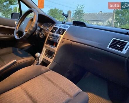 Чорний Пежо 307, об'ємом двигуна 1.59 л та пробігом 290 тис. км за 4200 $, фото 9 на Automoto.ua
