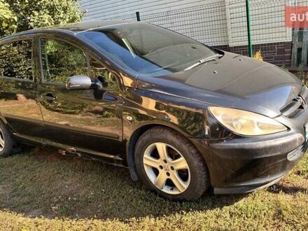 Черный Пежо 307, объемом двигателя 2 л и пробегом 205 тыс. км за 3900 $, фото 1 на Automoto.ua