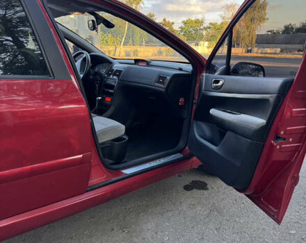 Красный Пежо 307, объемом двигателя 2 л и пробегом 127 тыс. км за 4200 $, фото 5 на Automoto.ua