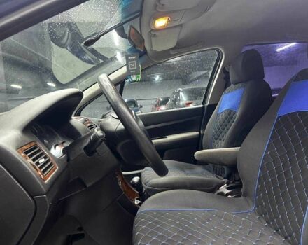 Синий Пежо 307, объемом двигателя 2 л и пробегом 260 тыс. км за 3900 $, фото 6 на Automoto.ua