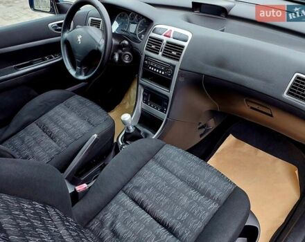 Синий Пежо 307, объемом двигателя 2 л и пробегом 265 тыс. км за 3550 $, фото 8 на Automoto.ua