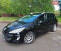 Черный Пежо 308, объемом двигателя 1.6 л и пробегом 299 тыс. км за 5100 $, фото 1 на Automoto.ua