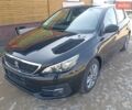 Чорний Пежо 308, об'ємом двигуна 1.5 л та пробігом 82 тис. км за 12300 $, фото 1 на Automoto.ua