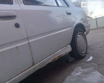 Белый Пежо 309, объемом двигателя 1.6 л и пробегом 300 тыс. км за 800 $, фото 10 на Automoto.ua