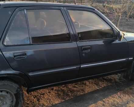 Черный Пежо 309, объемом двигателя 1.4 л и пробегом 89 тыс. км за 300 $, фото 3 на Automoto.ua