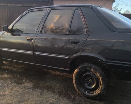 Черный Пежо 309, объемом двигателя 1.4 л и пробегом 89 тыс. км за 300 $, фото 1 на Automoto.ua