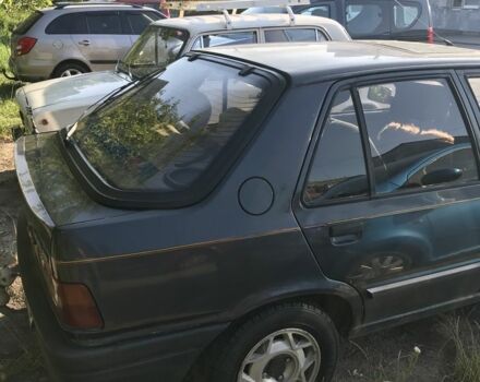 Черный Пежо 309, объемом двигателя 1.6 л и пробегом 320 тыс. км за 850 $, фото 2 на Automoto.ua