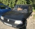 Черный Пежо 309, объемом двигателя 1.6 л и пробегом 320 тыс. км за 850 $, фото 1 на Automoto.ua