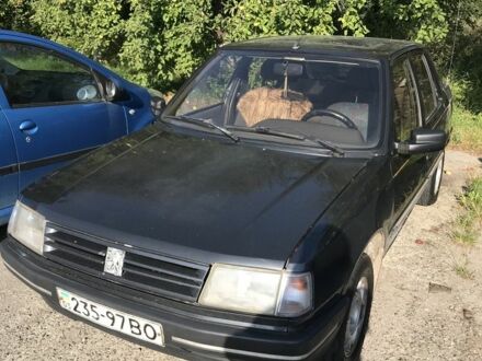 Черный Пежо 309, объемом двигателя 1.6 л и пробегом 320 тыс. км за 700 $, фото 1 на Automoto.ua
