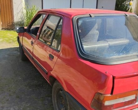 Красный Пежо 309, объемом двигателя 2 л и пробегом 300 тыс. км за 900 $, фото 4 на Automoto.ua