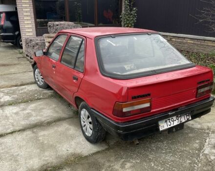 Красный Пежо 309, объемом двигателя 1.4 л и пробегом 250 тыс. км за 600 $, фото 3 на Automoto.ua