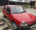 Красный Пежо 309, объемом двигателя 1.4 л и пробегом 250 тыс. км за 600 $, фото 1 на Automoto.ua