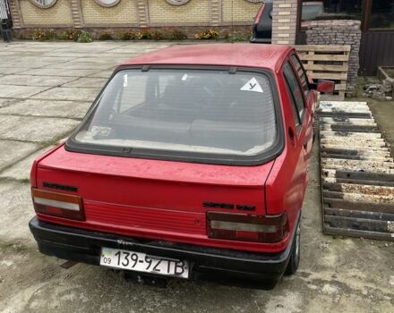 Красный Пежо 309, объемом двигателя 1.4 л и пробегом 250 тыс. км за 600 $, фото 2 на Automoto.ua