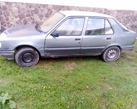 Сірий Пежо 309, об'ємом двигуна 1.36 л та пробігом 350 тис. км за 600 $, фото 1 на Automoto.ua